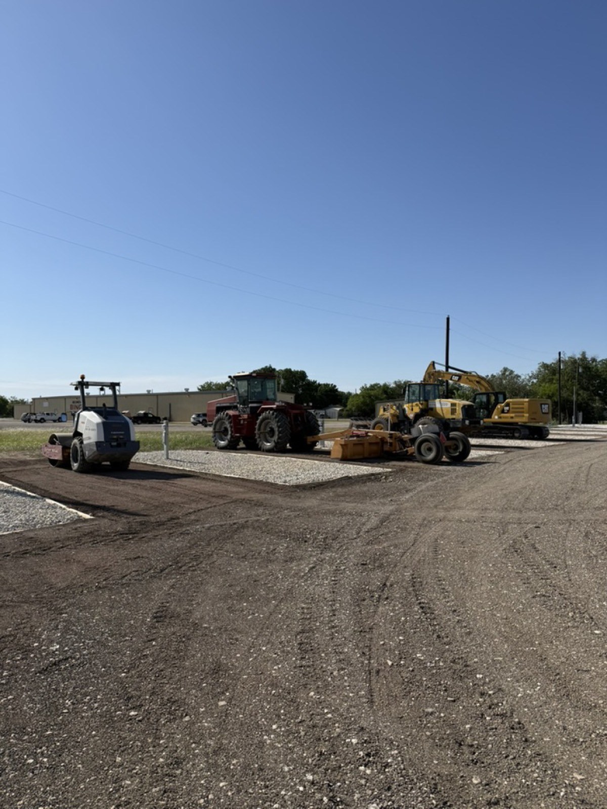 Fleet of equipment staged on a paved lot