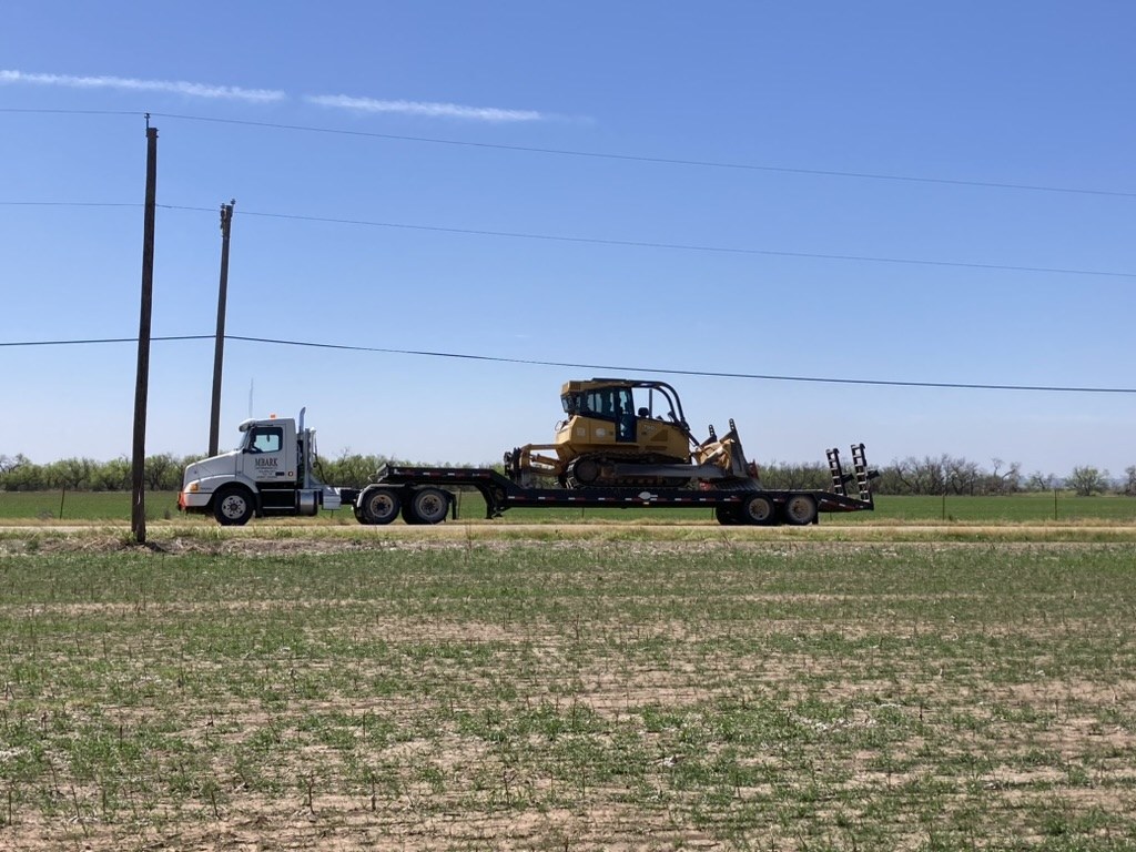 MBARK heavy haul truck and lowboy trailer for equipment transport